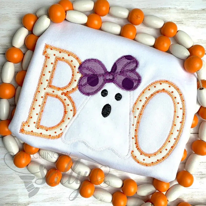 Front view of girls Halloween shirt with BOO appliqué and ghost with bow