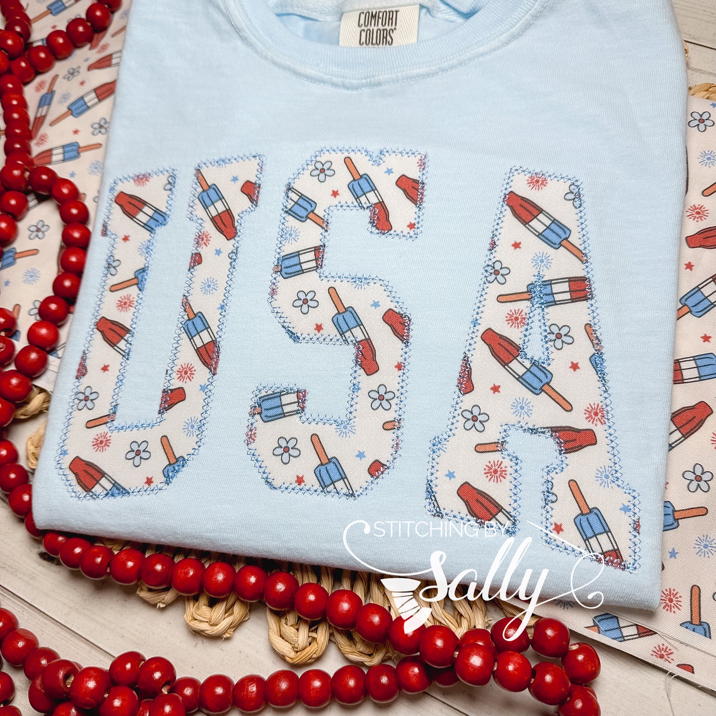 Oversized youth girls USA appliqué shirt, perfect for 4th of July, patriotic parades, and summer celebrations.