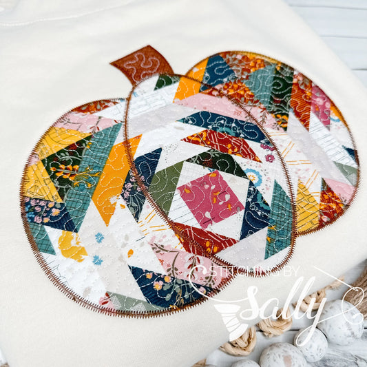 Close-up of quilted pumpkin design with textured stitching