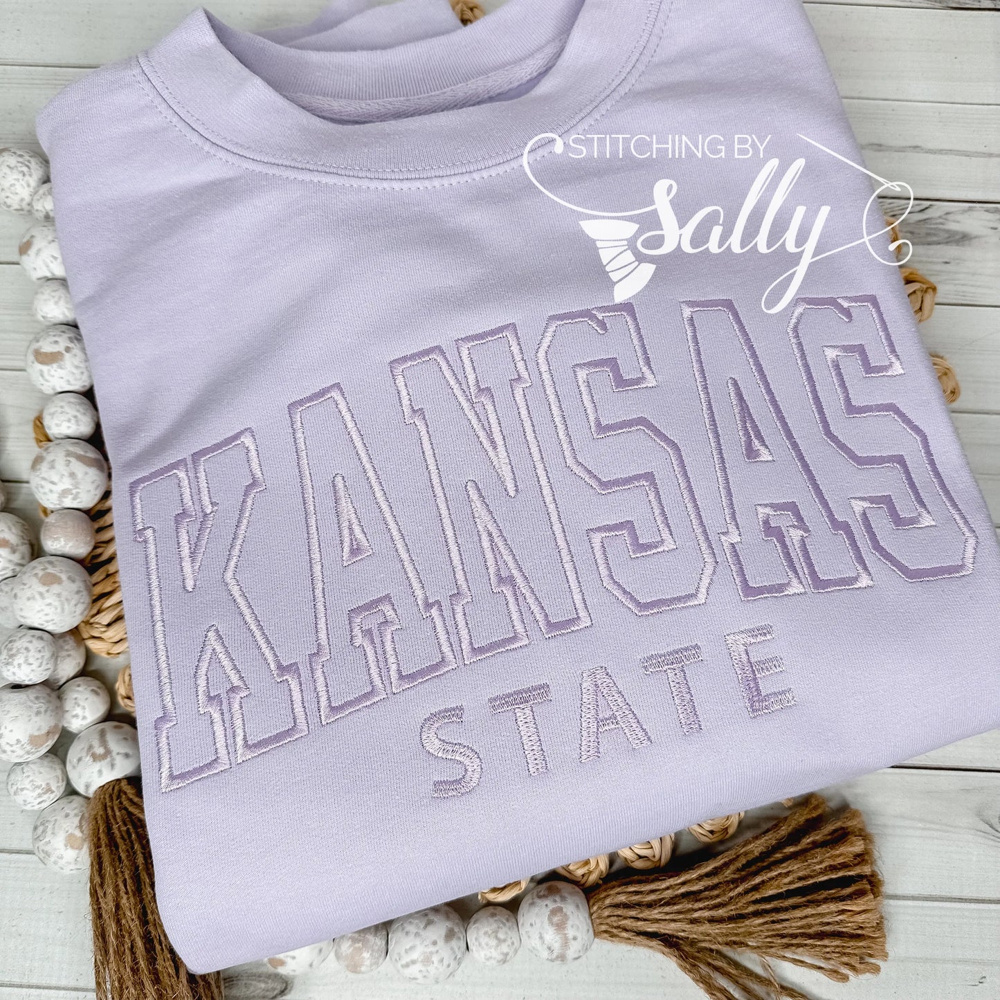 Custom varsity letter embroidered sweatshirt with personalized initials in bold collegiate font on cozy unisex crewneck