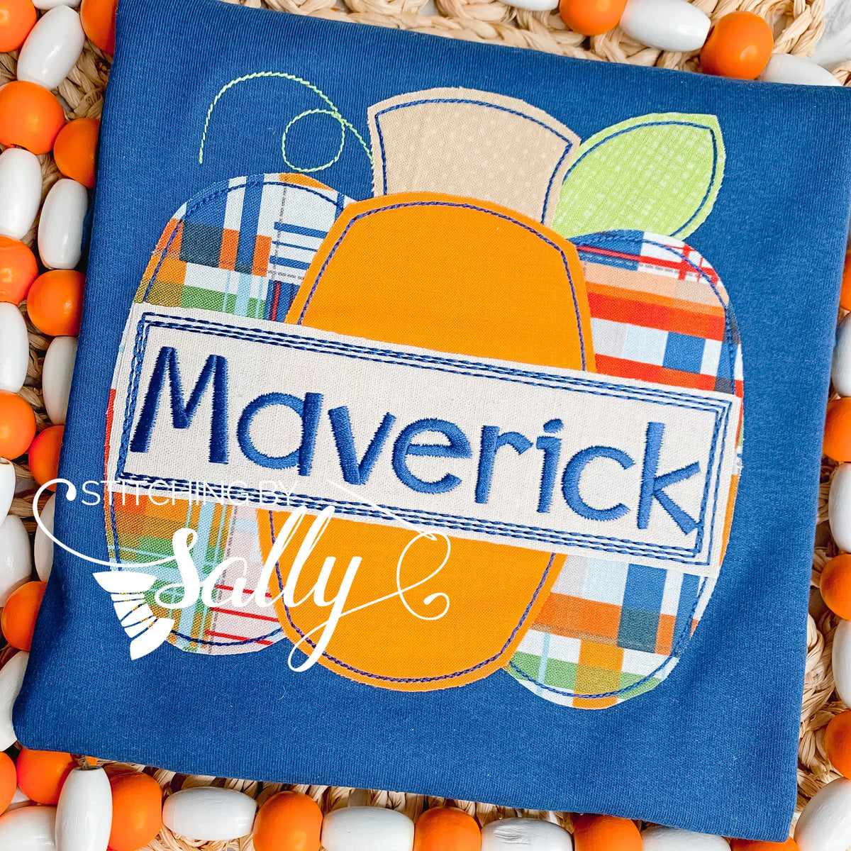 Close-up of colorful pumpkin design with embroidered name