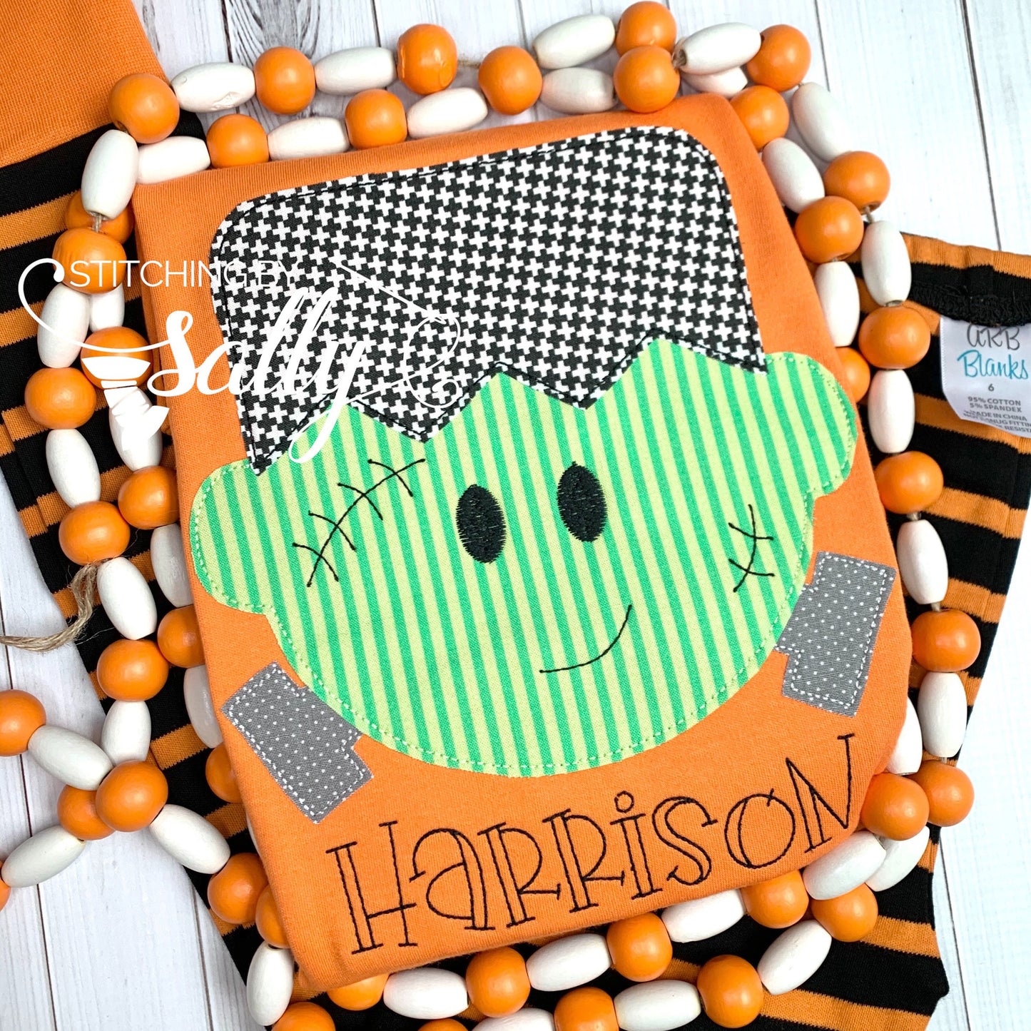 Close-up of friendly Frankenstein face with detailed stitching and name underneath
