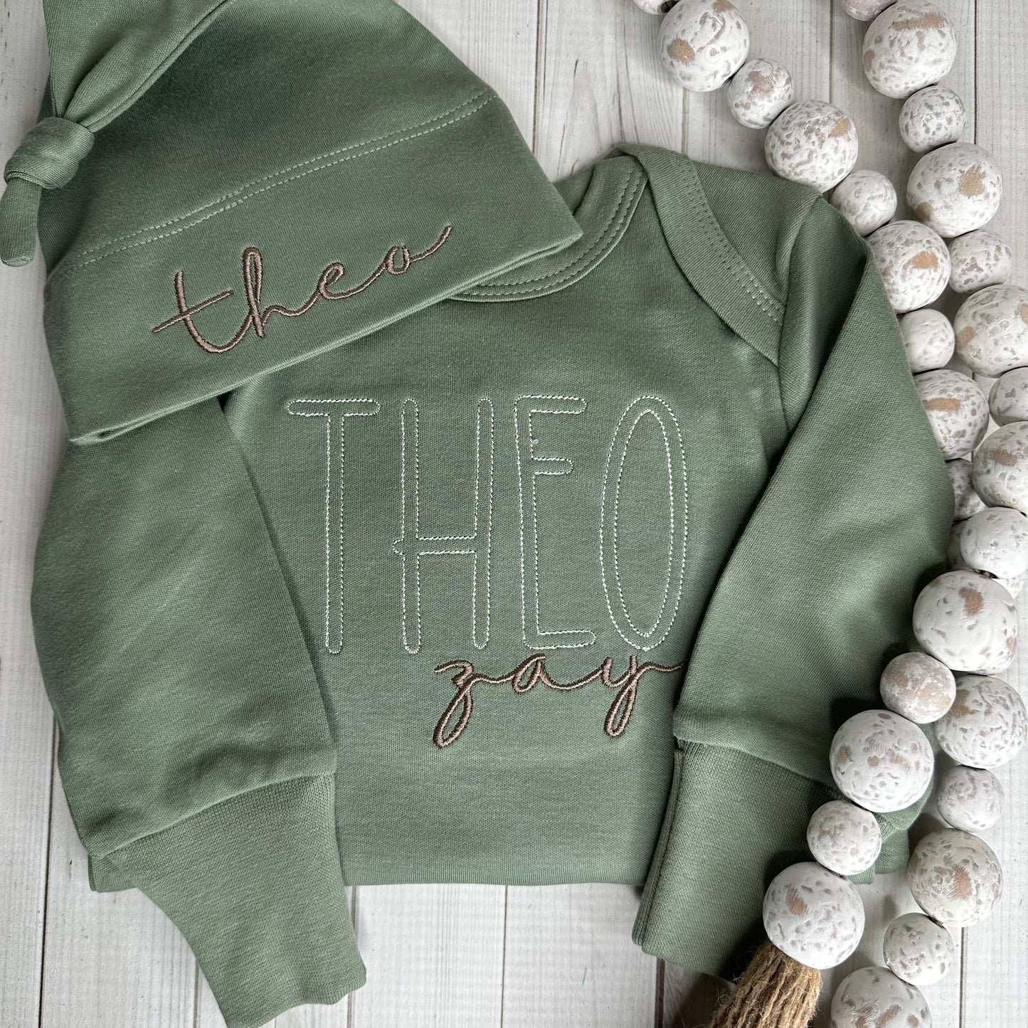 Sage green baby knot gown with embroidered name and matching hat