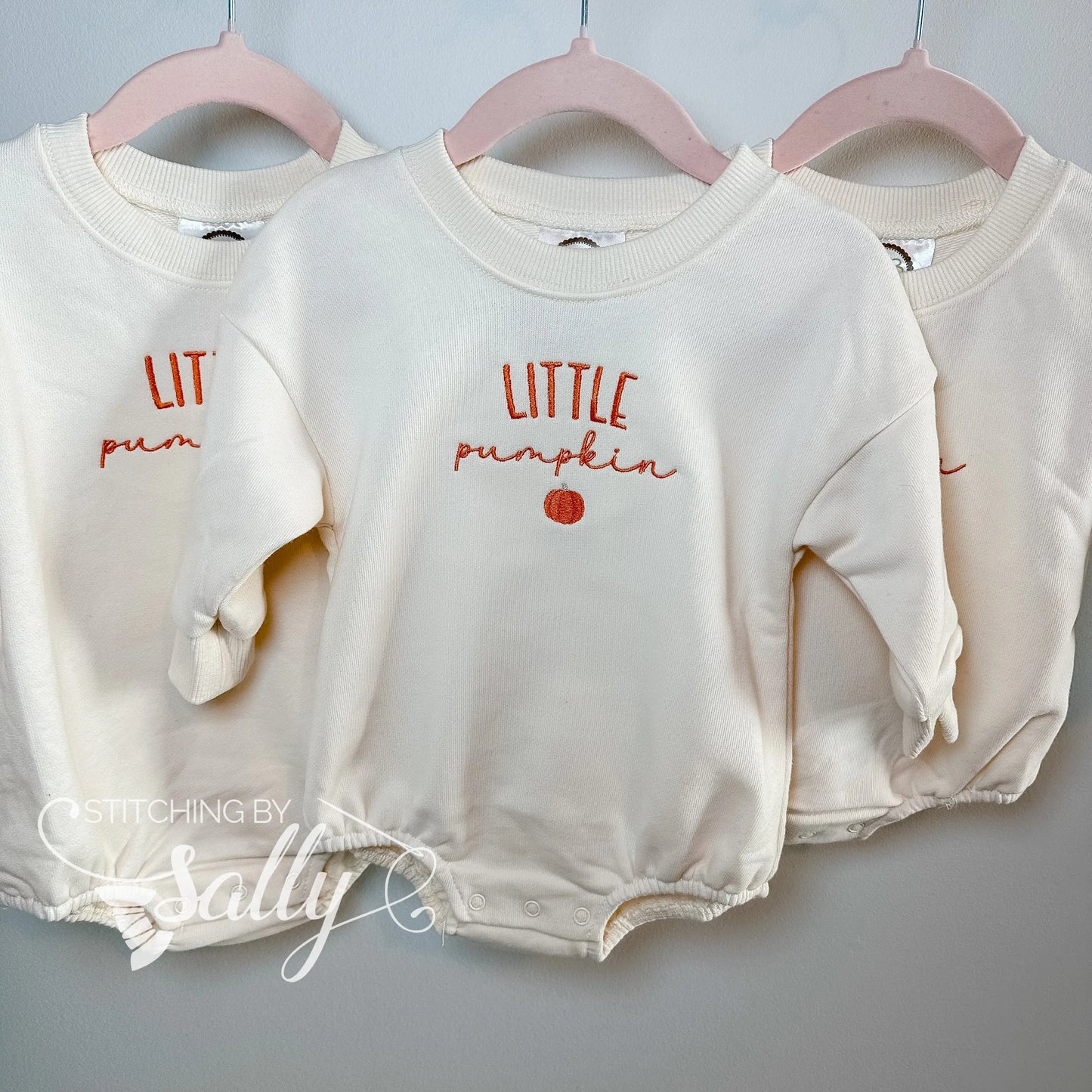 Burnt orange embroidered pumpkin on baby bubble sweatshirt