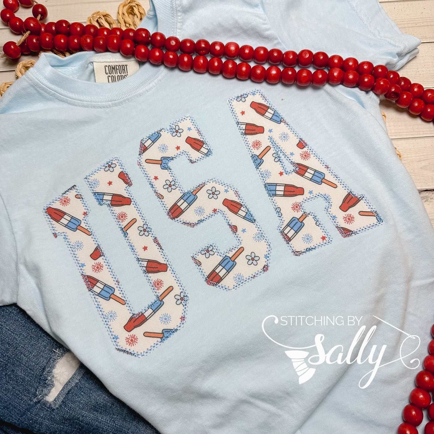 Oversized youth girls USA appliqué shirt, perfect for 4th of July, patriotic parades, and summer celebrations.