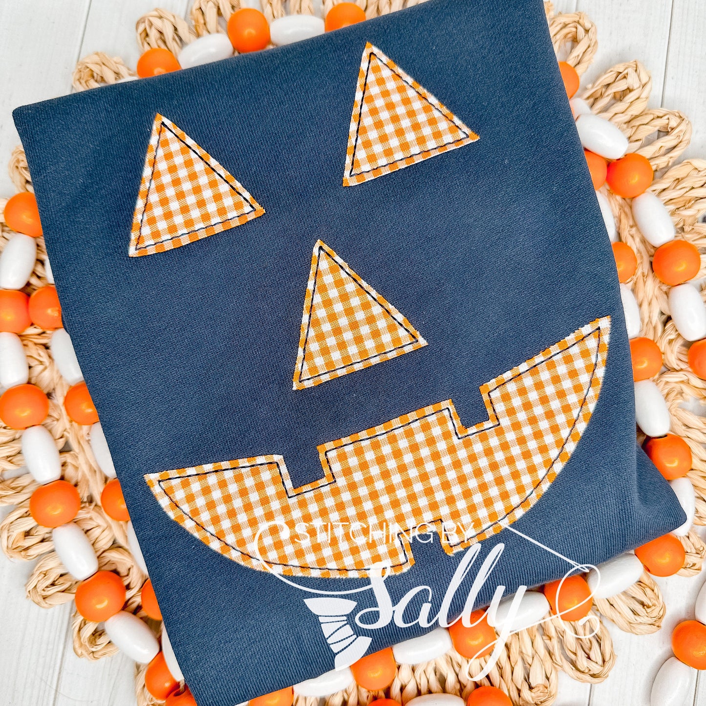 Navy toddler sweatshirt with appliqué jack-o'-lantern