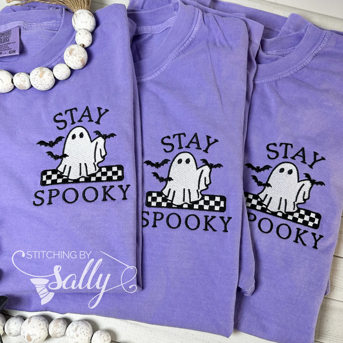 Three Violet embroidered t-shirts with “Stay Spooky” and ghost holding bats