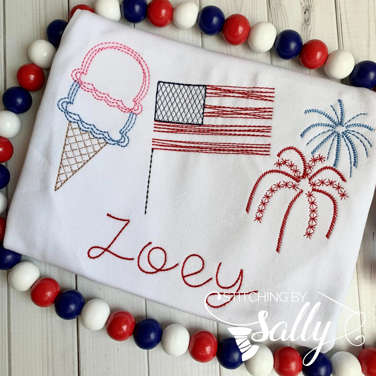 Embroidered toddler 4th of July shirt featuring an ice cream, flag, and fireworks, with optional personalized name.