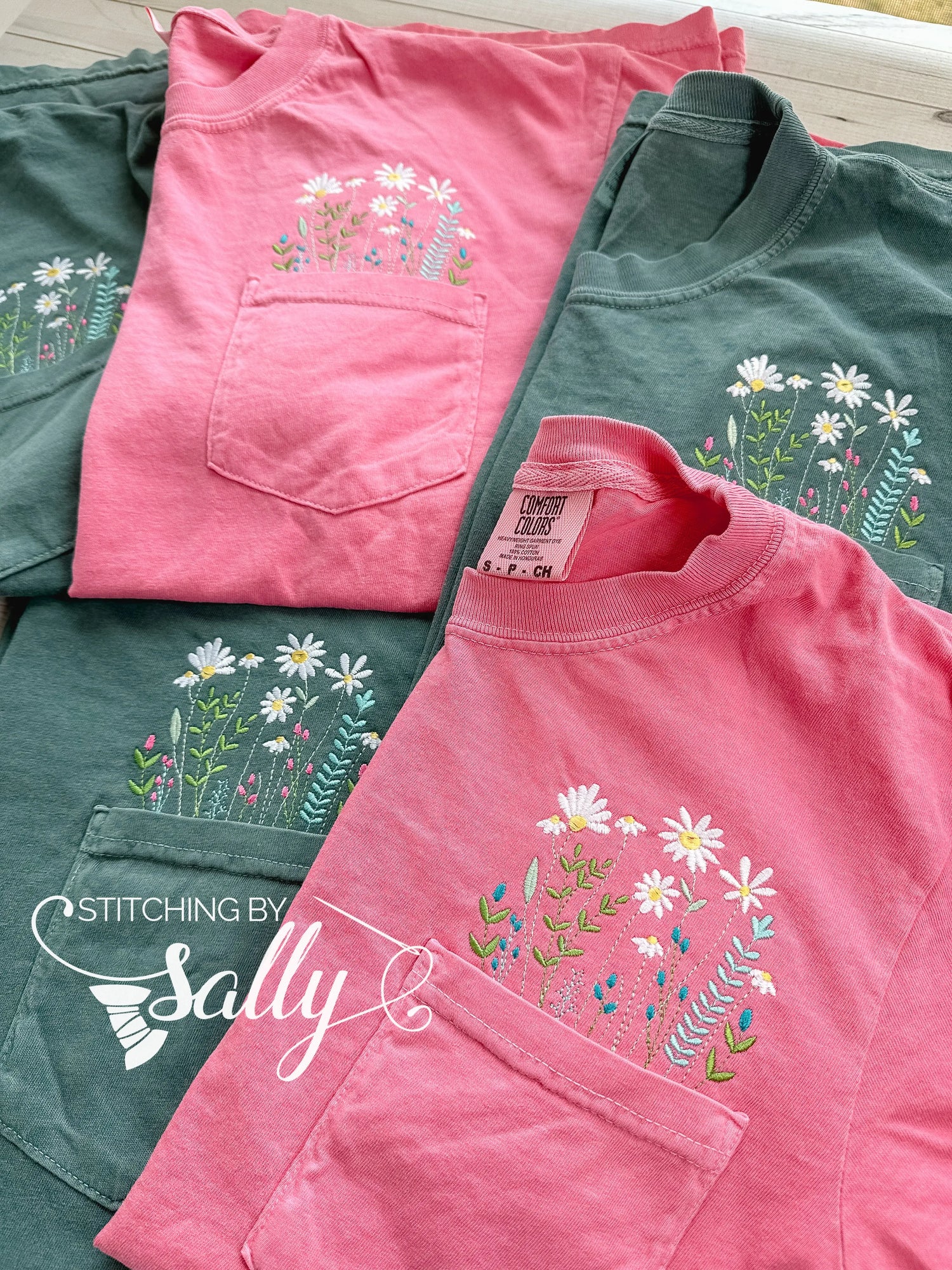 A cozy light pink sweatshirt featuring a coquette bow embroidered in hot pink thread. 