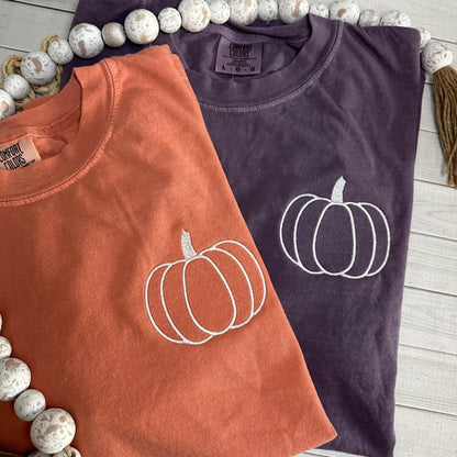 Orange and berry shirts with a simple pumpkin embroidered on left chest. 