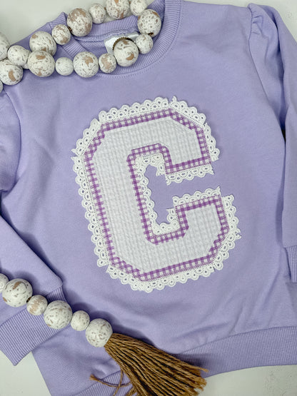 Personalized varsity letter crewneck sweatshirt with lace trim and patterned fabric letters