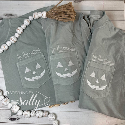 A group of three shirts with a Halloween design embroidered on the pocket 