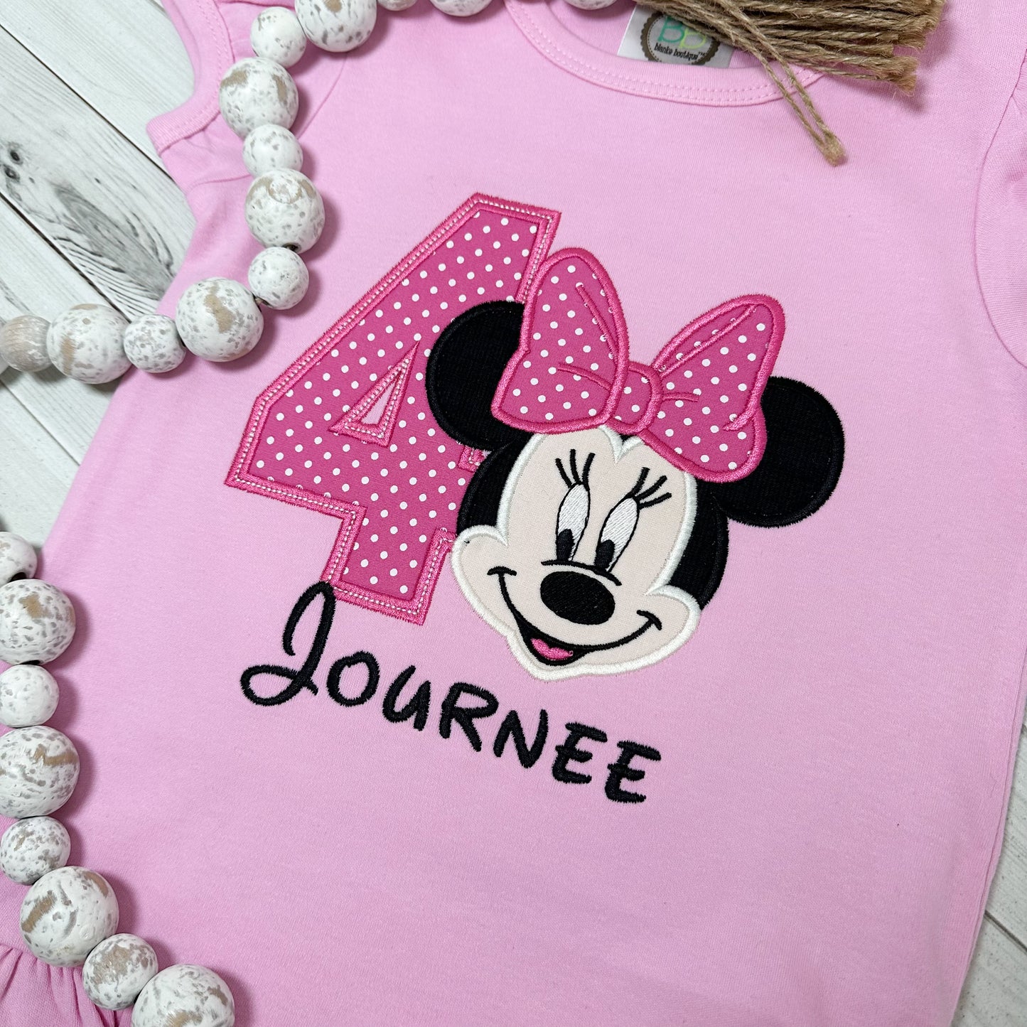 Close up of Minnie and number applique. birthday shirt for girls.