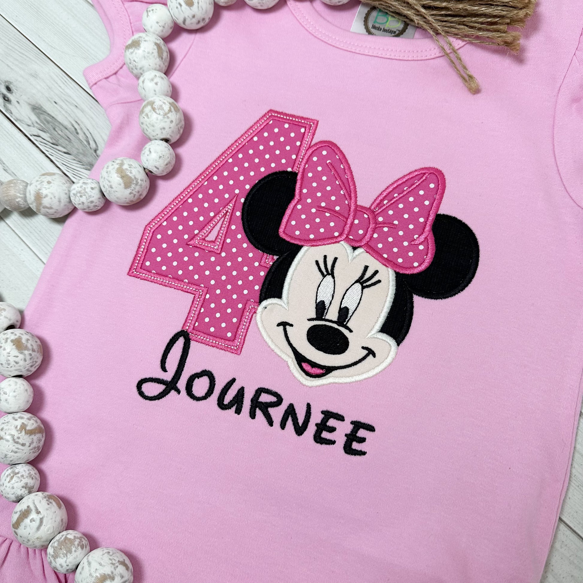 Close up of Minnie and number applique. birthday shirt for girls.