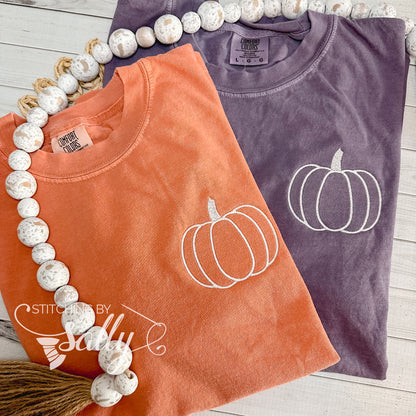 Orange and berry shirts with a simple pumpkin embroidered on left chest. 