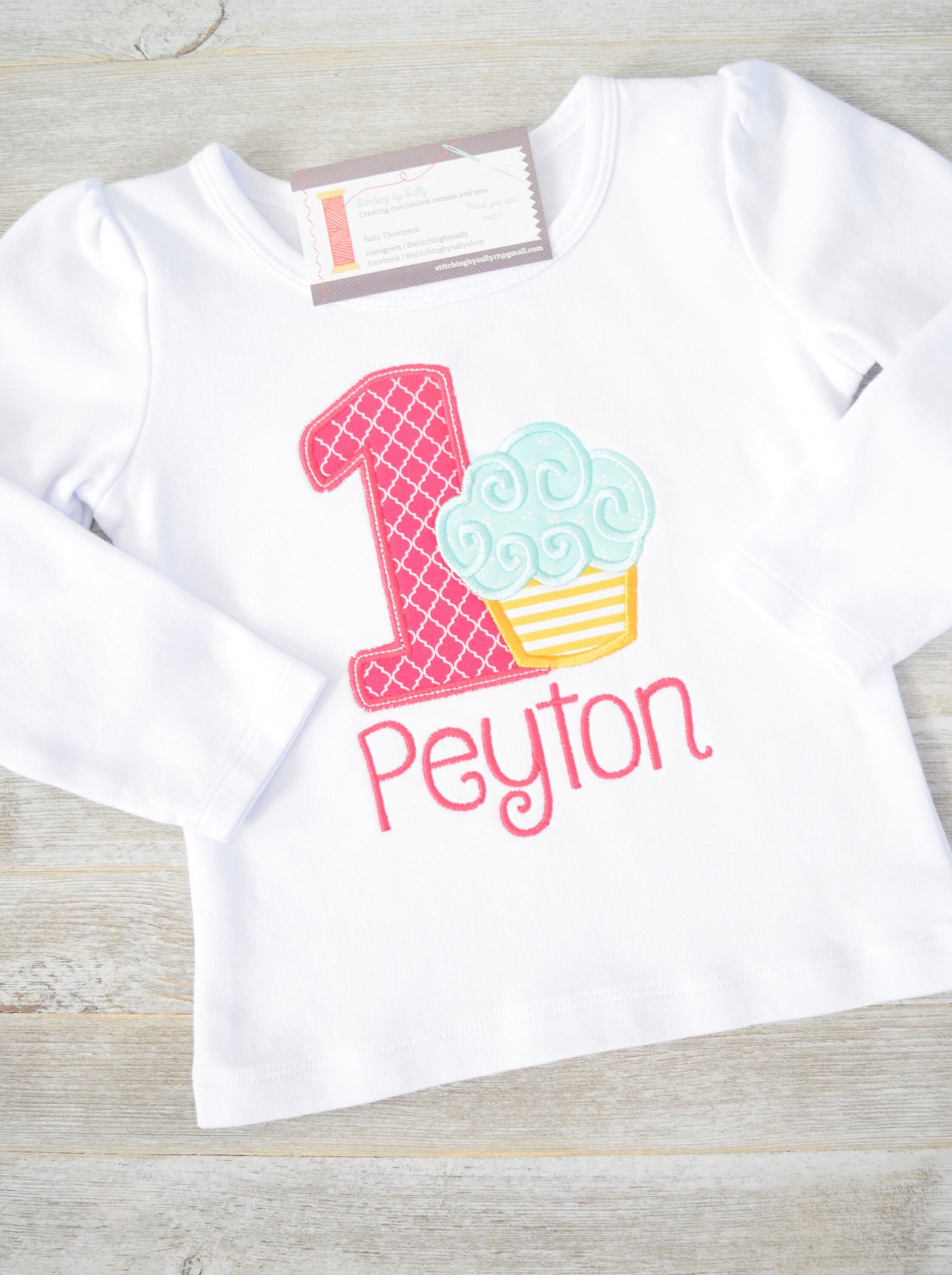 Girls cupcake first birthday appliqué shirt with embroidered number one, perfect for cake smash and party celebrations