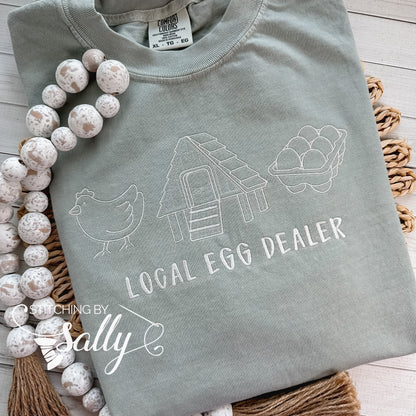 Local Egg Dealer embroidered t-shirt on Comfort Colors, perfect for backyard chicken keepers and homesteaders."