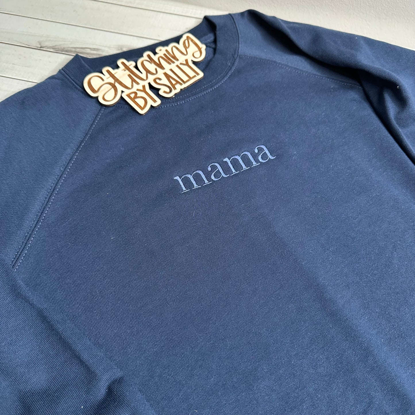 mama embroidered on front center of navy lightweight crewneck