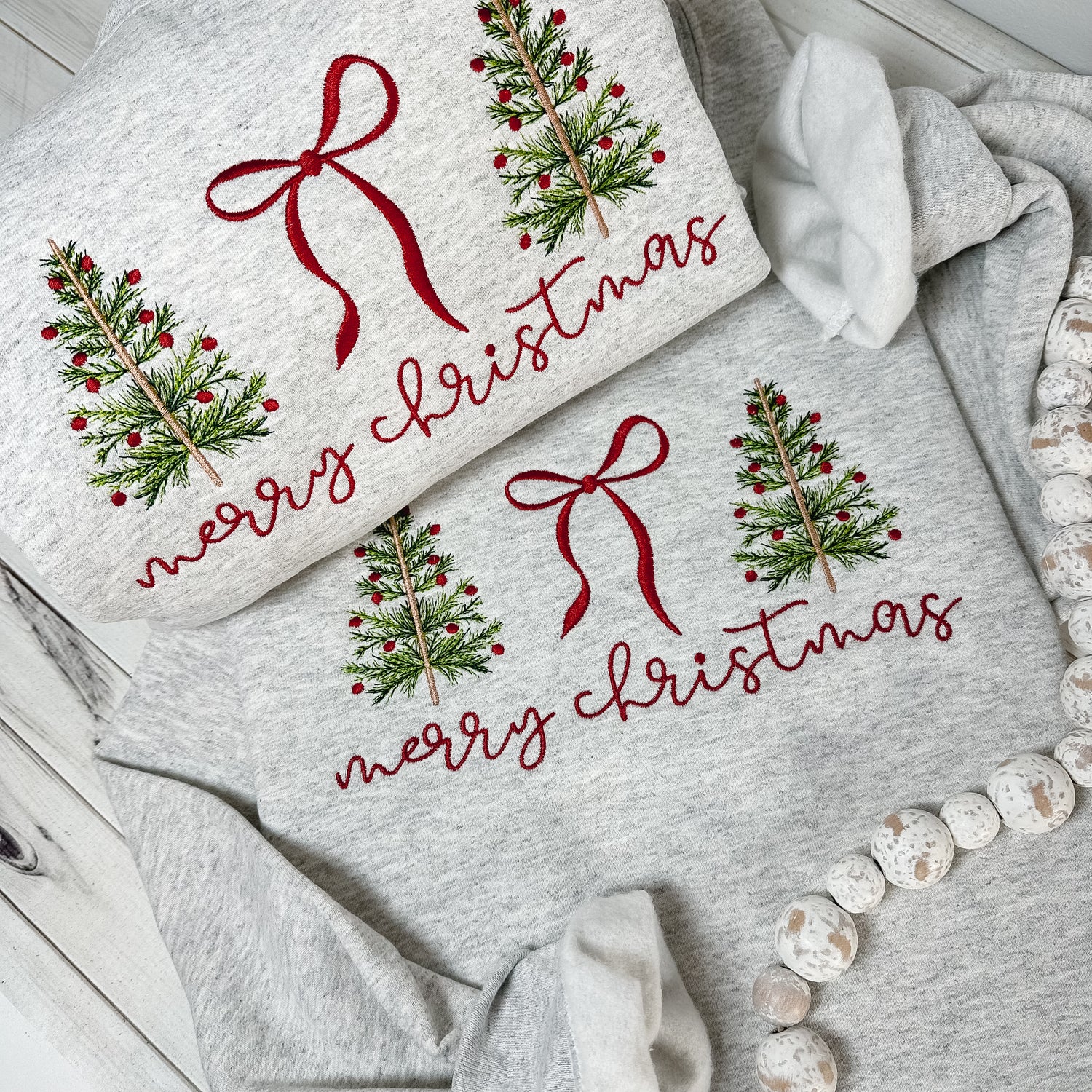 Merry Christmas sweatshirt features the sweetest stitched trees + bow design.
