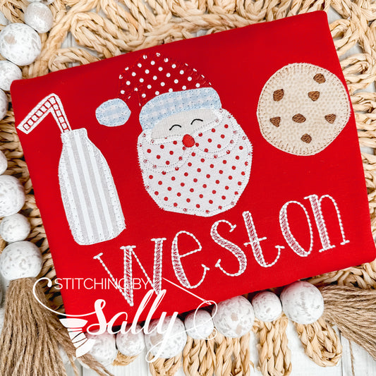 Unisex kids Christmas shirt with appliqué design of a milk jug and cookie.