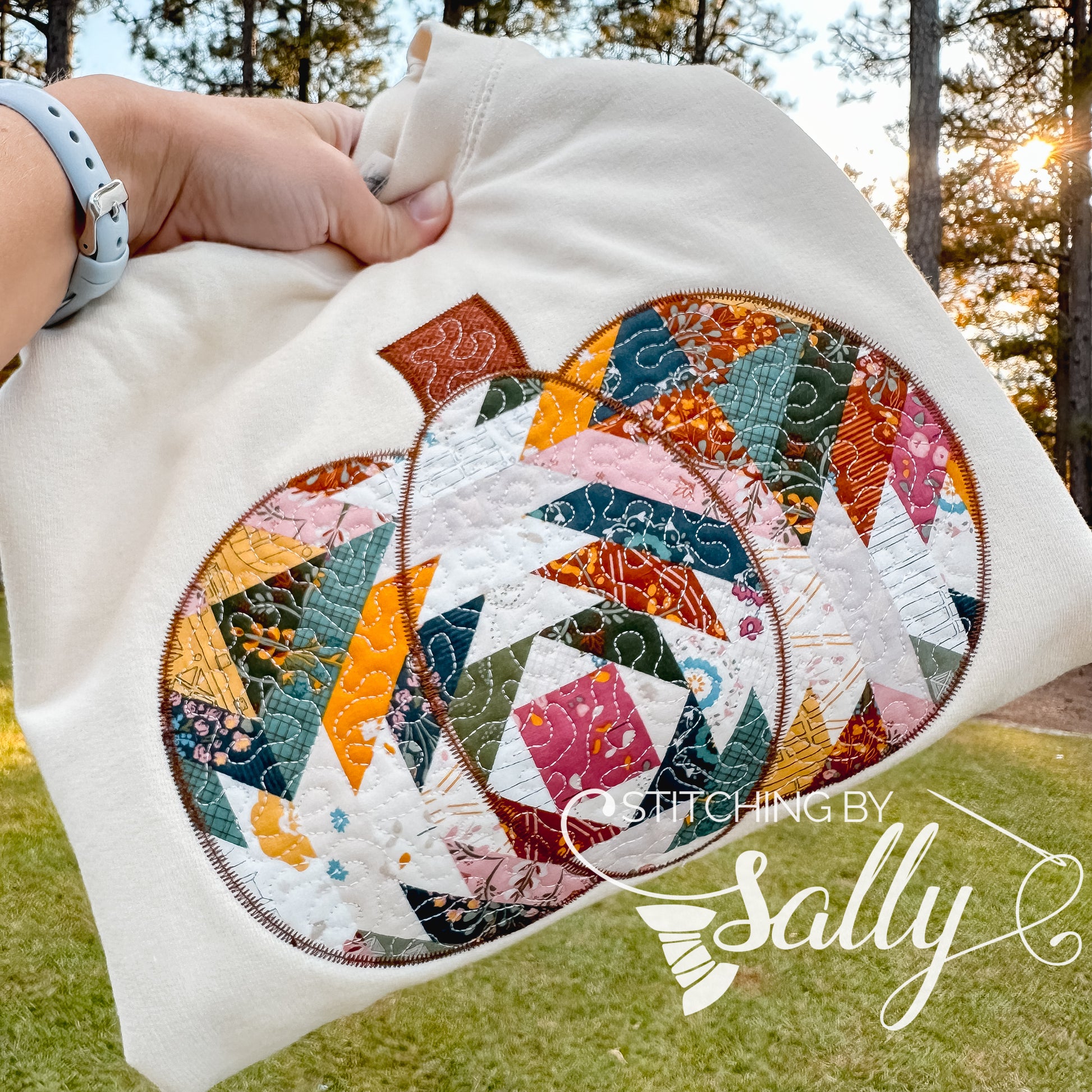 Folded sweatshirt showing applique and fabric texture