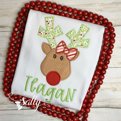 Close up of reindeer applique with bow shirt design