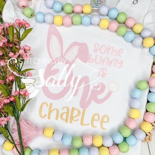 Some Bunny Is One birthday appliqué shirt with embroidered bunny design, perfect for a first birthday celebration.