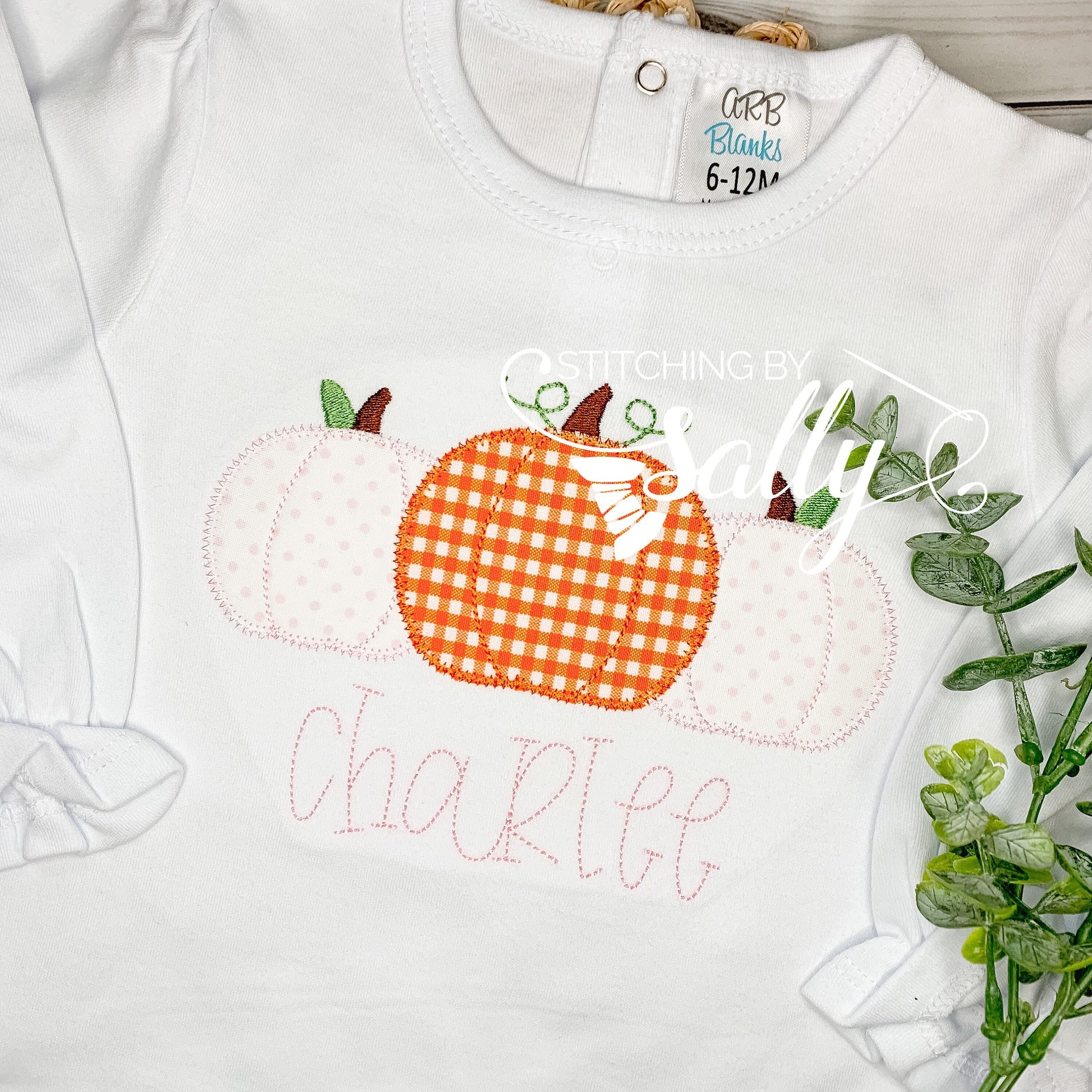 Close-up of pink polka-dot and orange gingham pumpkin design