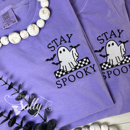 Ghost and bats embroidered design on purple shirt