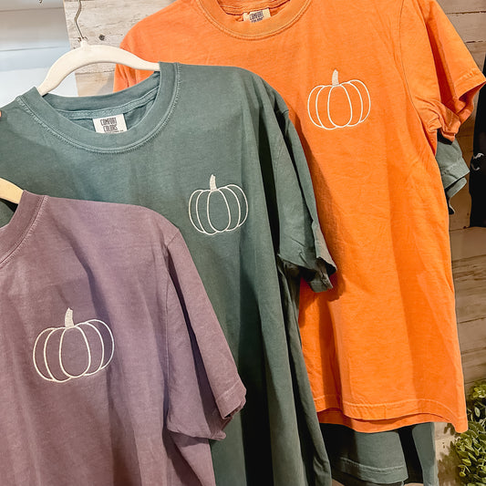 Three shirts with a simple pumpkin embroidered on left chest