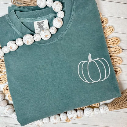 Blue Spruce shirt with a pumpkin embroidered in cream thread. 