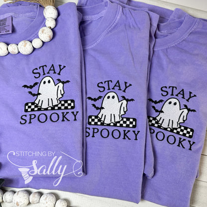 Three Violet embroidered t-shirts with “Stay Spooky” and ghost holding bats